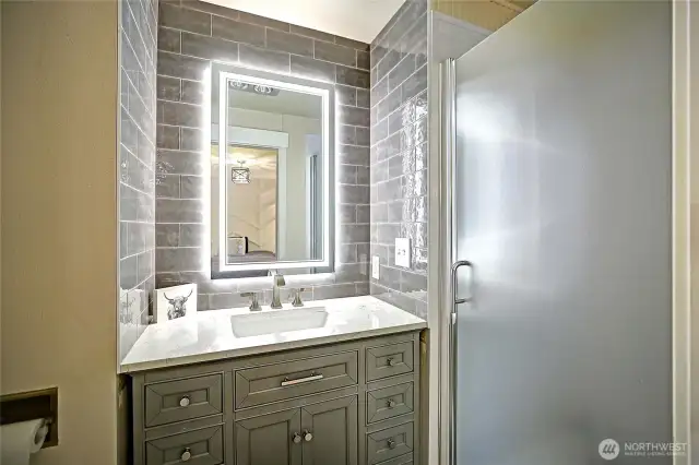 Primary en-suite, 3/4 bath...new tile, vanity, paint, LED mirror.