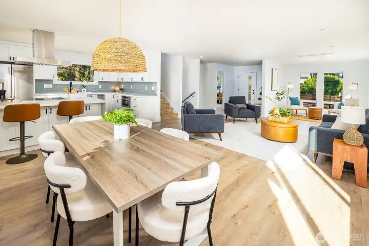 Once inside, soak in the warmness and ample lighting in this open concept main floor.  Huge living room, bonus reading nook, large dining room, office, powder room and fantastic kitchen area!