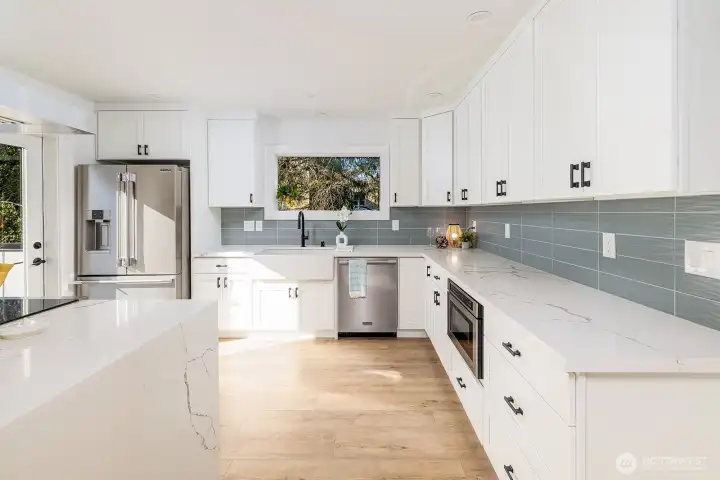 Expansive counters and generous cabinetry elevate both function and style—this home is designed for effortless living.