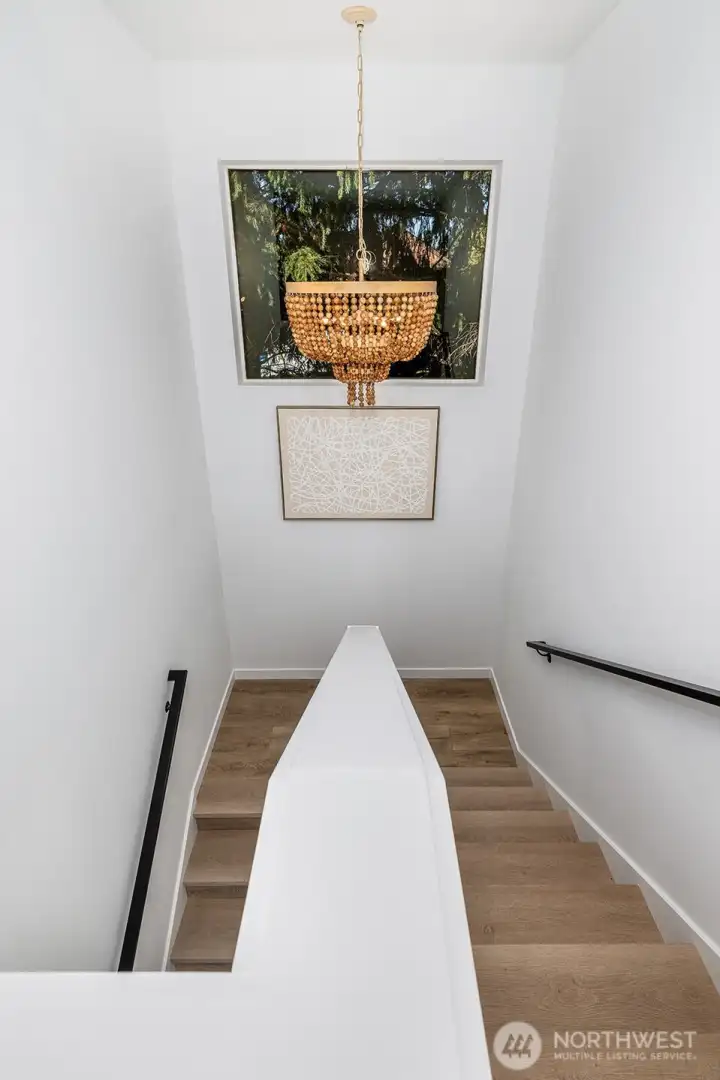 Dramatic stairway lighting leading up to the top floor.
