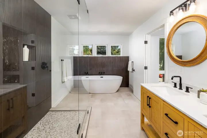 A serene 5-piece primary suite bath, crafted with refined finishes and intentional design.  Separate soaking tub, walk in shower, private toilet room with matching cabinetry.