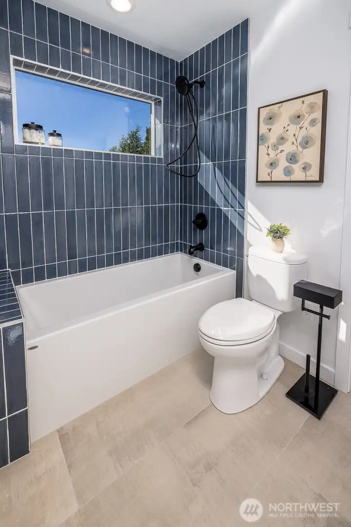 Full tiled shower in Jack and Jill bathroom on second floor.  Heated floors keep you warm and cozy!