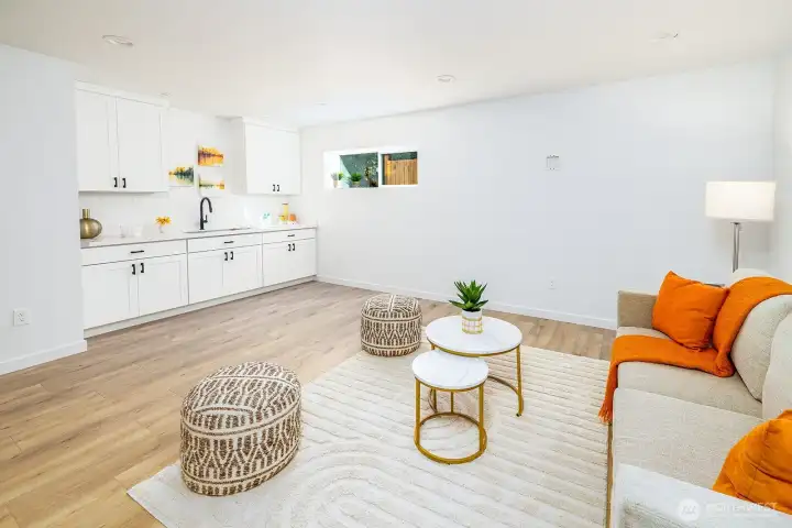 The lower level is a showstopper—complete with a generous bonus room, wet bar/second kitchen, bedroom, full bath, and a utility room that blends style with function.