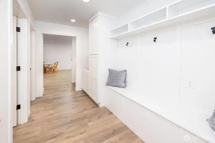 Another view of the mud room space looking towards the huge lower level bonus room space.