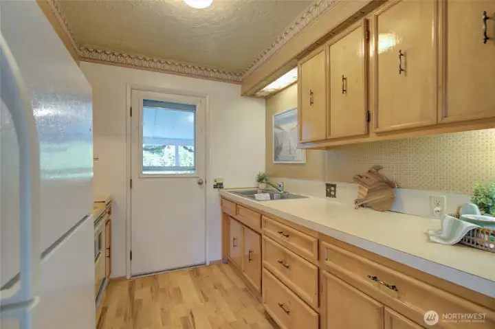 Galley kitchen with quality wood cabinets