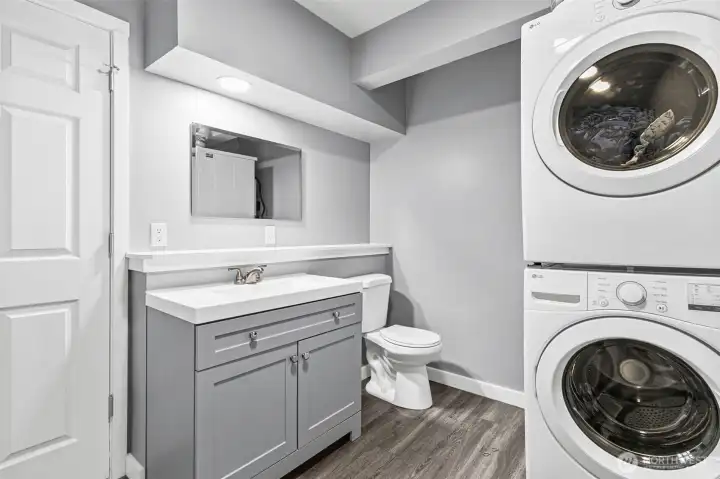 Full bath and stackable washer dyer in Basment
