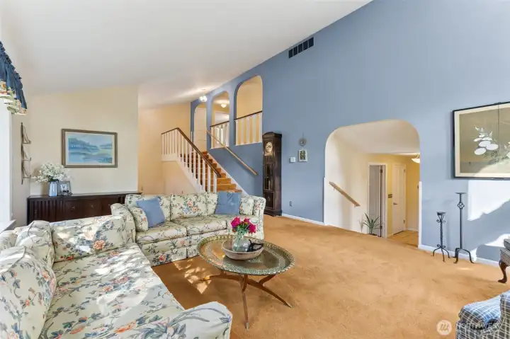 Another view of the living room. Stairs leading to bedrooms.