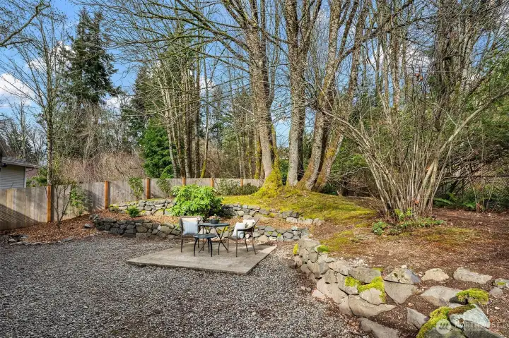 Private fenced yard has room for play area, hot tub and more