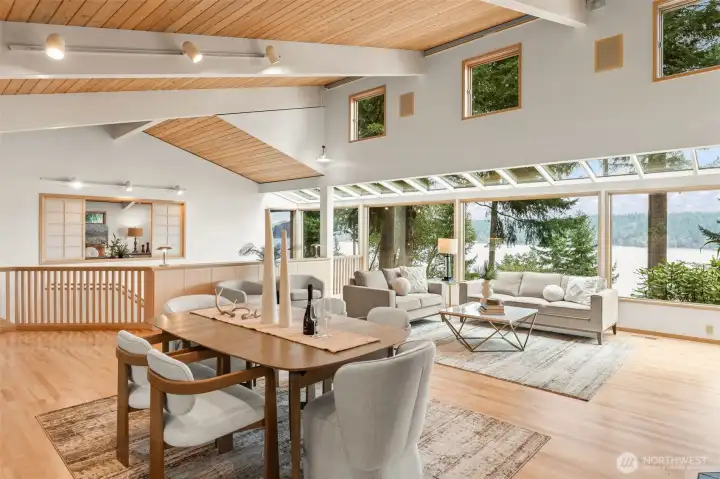 The windows to the views and the creative design of pitched ceilings in shiplap cedar are THE ART in this home.