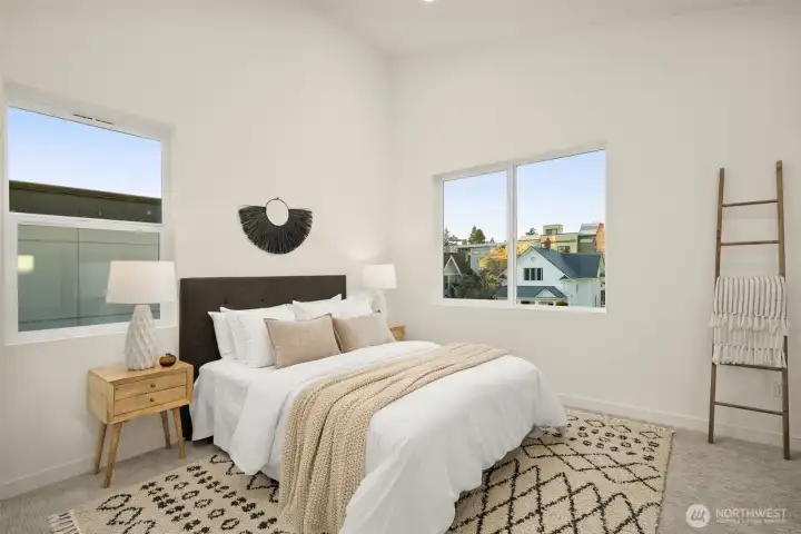 The large primary suite is open and airy.