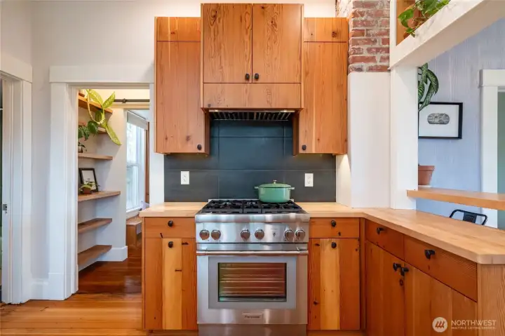 Kitchen features a high-end Thermador gas range.
