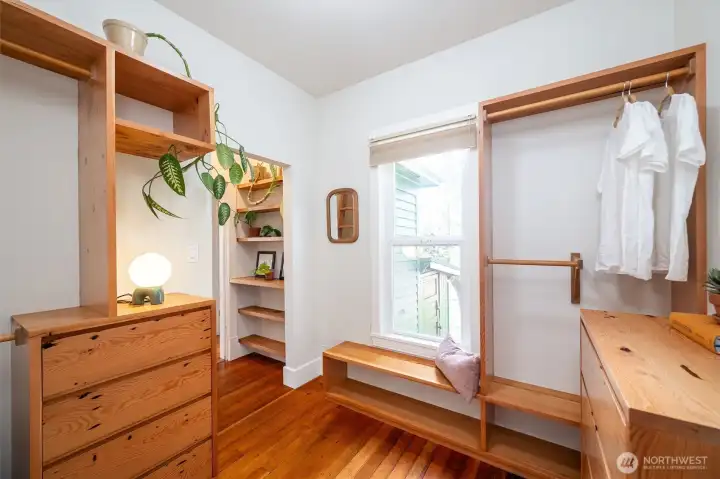 Even the primary closet features beautiful built-ins, using the same reclaimed wood found in the kitchen.