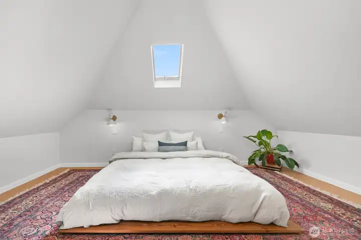 Upstairs bedroom in the converted attic. Amazing natural light from a skylight.