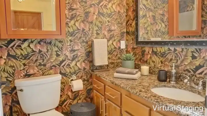 Primary bathroom conveniently located off the primary suite, accessed through dual walk-in closets for added functionality and privacy.