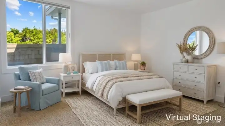 Bright main-level second bedroom with large windows that bring in natural light and offer a peaceful view, creating a comfortable and inviting retreat.