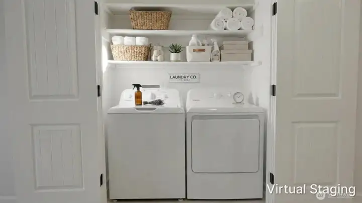 Convenient laundry area with side-by-side washer and dryer, complemented by overhead shelving for added storage and organization.