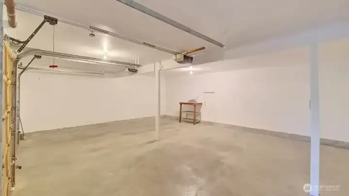 Oversized two-car garage with expansive open space.