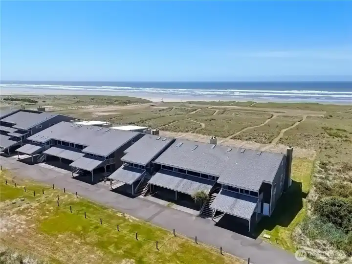 Oceanfront condo with private paths leading directly through the dunes to the beach, offering exceptional access to miles of sandy shoreline and sweeping Pacific Ocean views.