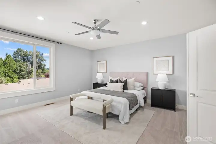 The spacious primary suite showcases beautiful Lake Washington views, a luxurious spa-like bath, and direct access to its own private deck.