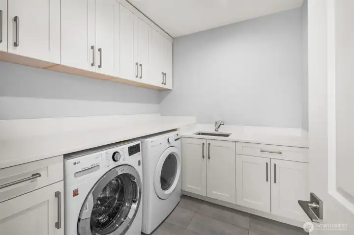 An upstairs laundry area is ideally positioned near all bedrooms, adding comfort and convenience to daily routines.