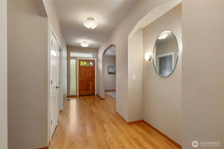 Front entry hallway: 4th bedroom/ den to the left, formal dining room to the right.