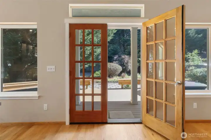 French doors open onto deck and back patio