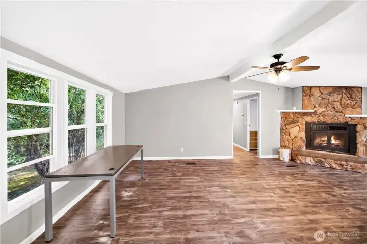 Great room (Fireplace chimney was covered when re-roofed in August of 2025. (flame was added to picture) Great room (Fireplace chimney was covered when re-roofed in August of 2025. (flame was added to picture)