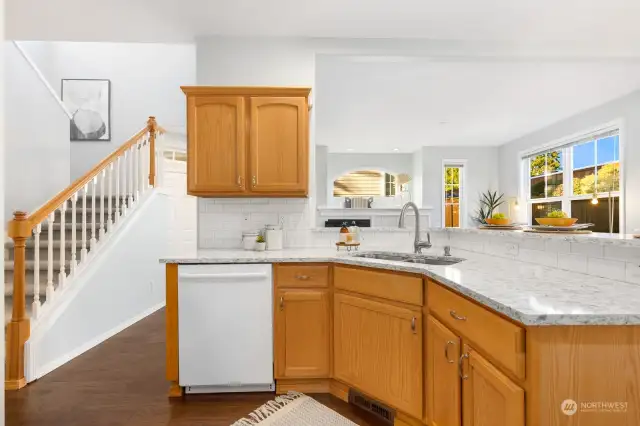 The heart of the home—this spacious kitchen features plenty of counter space and a breakfast bar for casual meals or entertaining.