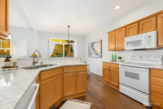 The heart of the home—this spacious kitchen features plenty of counter space and a breakfast bar for casual meals or entertaining.