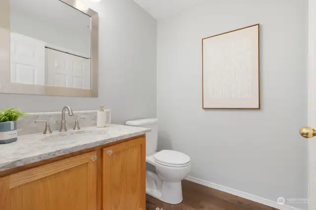 Stylishly updated, this powder room features elegant finishes and a bright, clean look for your guests.