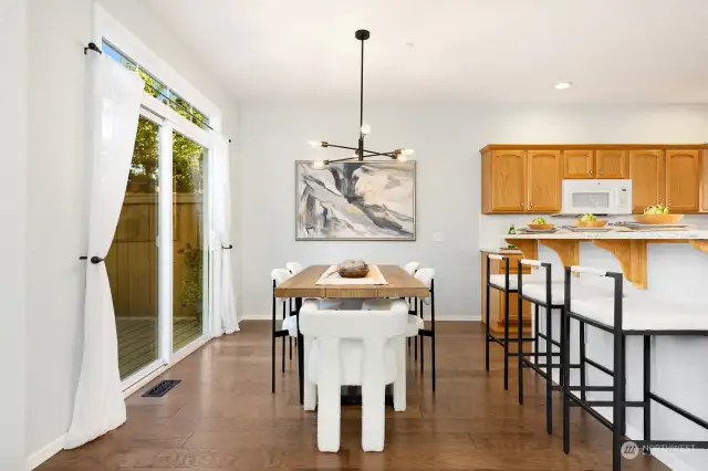 Gather around the heart of the home! The kitchen offers a charming breakfast bar, sleek countertops, and ample cabinet space to inspire your culinary creations.