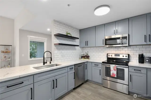 Kitchen with newer cabs and Quartz counters