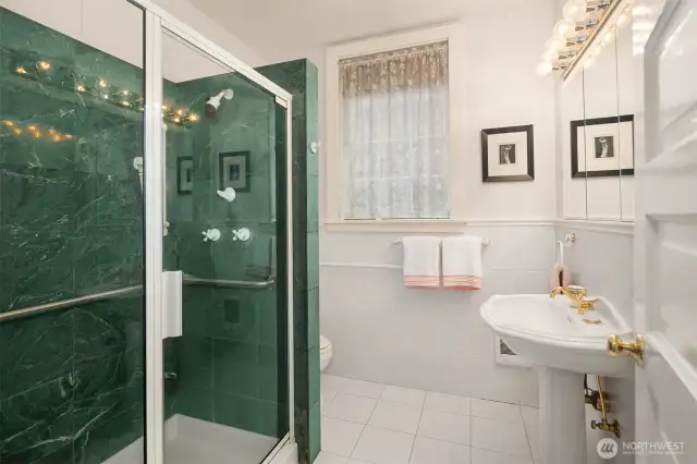 3/4 bathroom on the main floor. Solid stone tile surround.