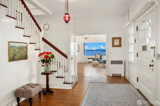 Foyer, front door on the right. Upon entry take a right to the expansive living room that overlooks the Puget Sound or left to the formal dining room.