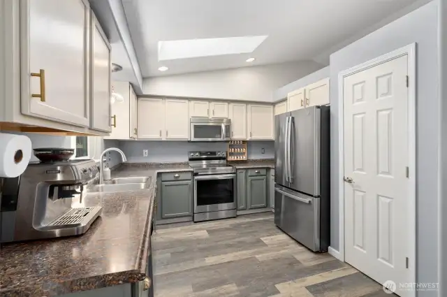 Vinyl planking is throughout most this lovely home! Notice how many cabinets are in this spacious kitchen!!!! A lot!