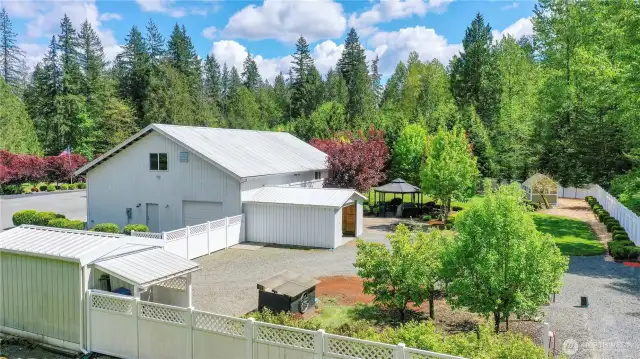 This extraordinary 40x64 detached garage boasts impeccable shop areas, including a dedicated welding room, alongside amazing living spaces—offering the perfect combination of functionality and comfort.