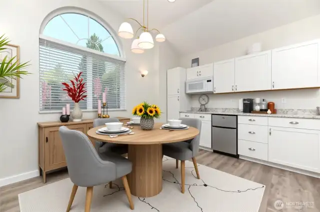 *VIRTUAL STAGE* The kitchenette, complete with room for a table, is perfect for stocking up on snacks and drinks, making it an ideal setup for theater nights and entertaining in this great gathering space.
