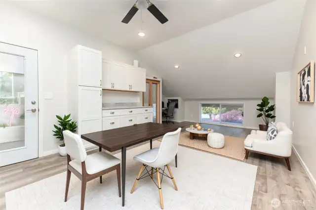 *VIRTUAL STAGE* This large office space, located above the garage, offers the perfect setting for a home office. Dual staircases provide added privacy, separating this room from the main living quarters.