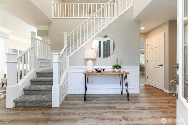 The main foyer offers a warm and welcoming introduction to this remarkable home, making a lasting first impression on you and your guests.