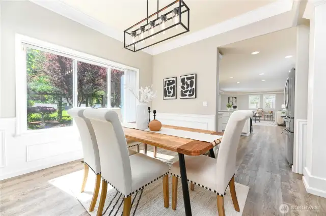 The dining room is thoughtfully positioned just off the kitchen, creating a seamless flow that's perfect for entertaining and everyday convenience.