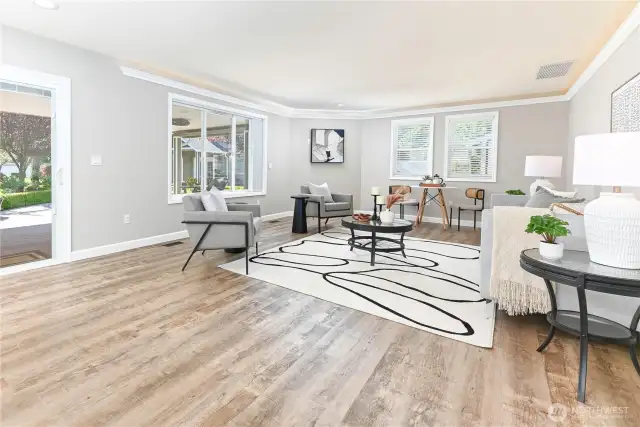 The inviting family room offers a cozy retreat with plenty of space for everyday living, movie nights, or casual entertaining.