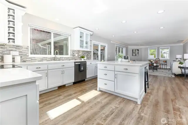 The chef-inspired kitchen opens seamlessly to the family room, creating a connected and welcoming space ideal for entertaining and everyday living.