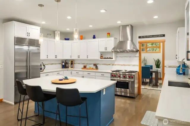 A beautiful, functional and inviting Chef's kitchen with gas Wolf range, Meile dishwasher, SubZero refrigerator and pantry.