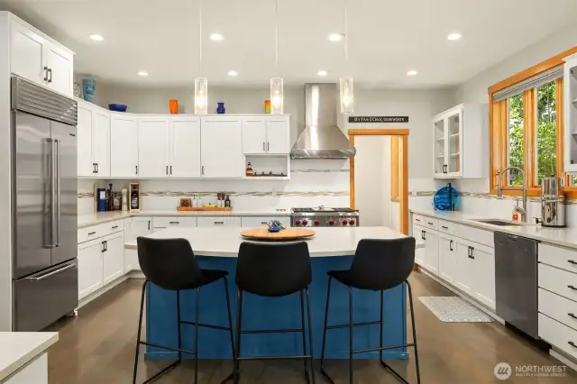 A beautiful, functional and inviting Chef's kitchen with gas Wolf range, Meile dishwasher, SubZero refrigerator and pantry.