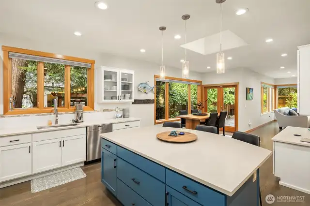 Adjacent is a large eating nook and planning desk, with great sightlines to the family room and outdoor space.