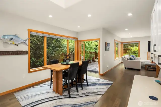 Adjacent is a large eating nook and planning desk, with great sightlines to the family room and outdoor space.