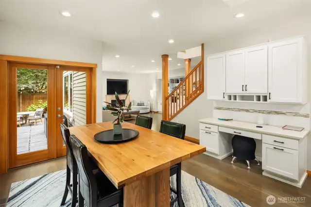 Adjacent is a large eating nook and planning desk, with great sightlines to the family room and outdoor space.