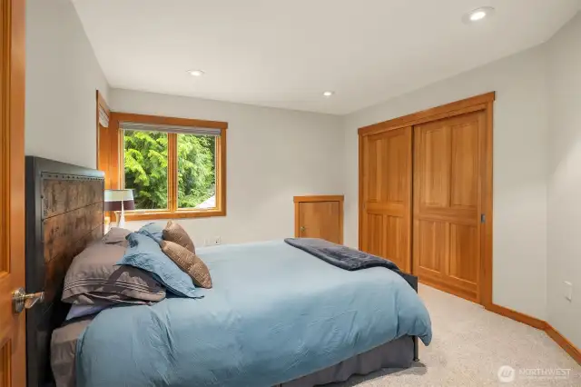 A view of the 4th bedroom which features attic space for seasonal or extra storage.