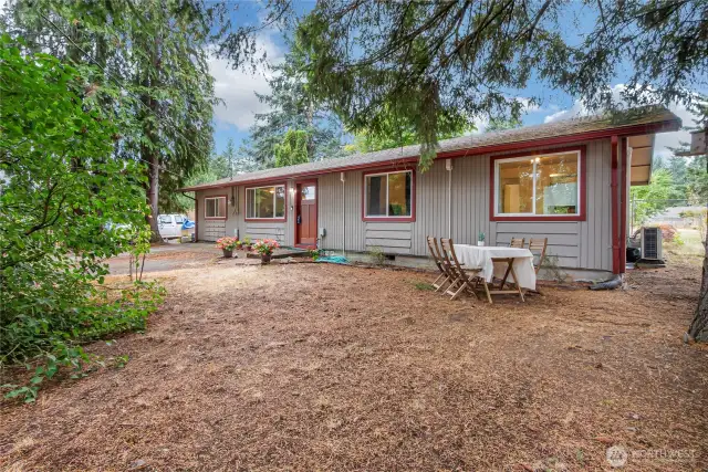 Wooded front yard with lots of parking - circular driveway not pictures.