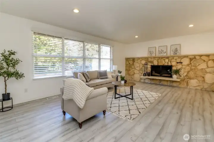 Large living room with wood burning fireplace